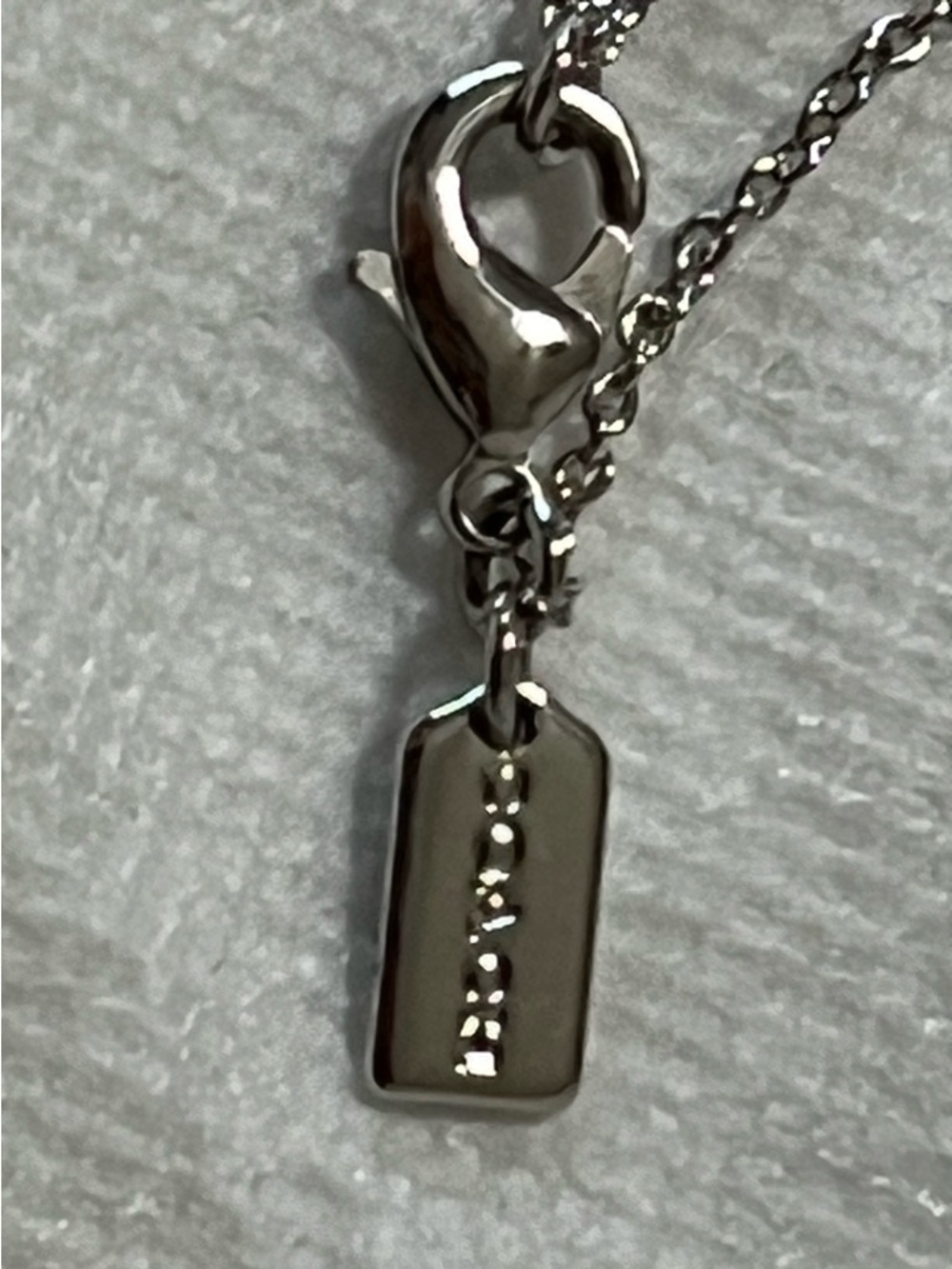 COACH Silver-Tone Crystal Accent Pendant Necklace - Picture 2 of 7